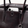 Ebony Yore Toast Bag: Full-grain Nappa leather, contrast stitching, exterior pocket with phone, Songmont logo.