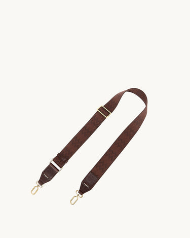 Brown fabric shoulder strap with herringbone pattern, leather accents, and gold hardware.