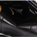 Black calf leather medium bag with gold chain strap and interior butterfly lining.