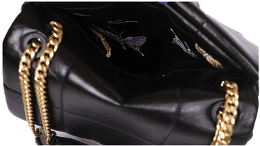 Black calf leather medium bag with gold chain strap and interior butterfly lining.